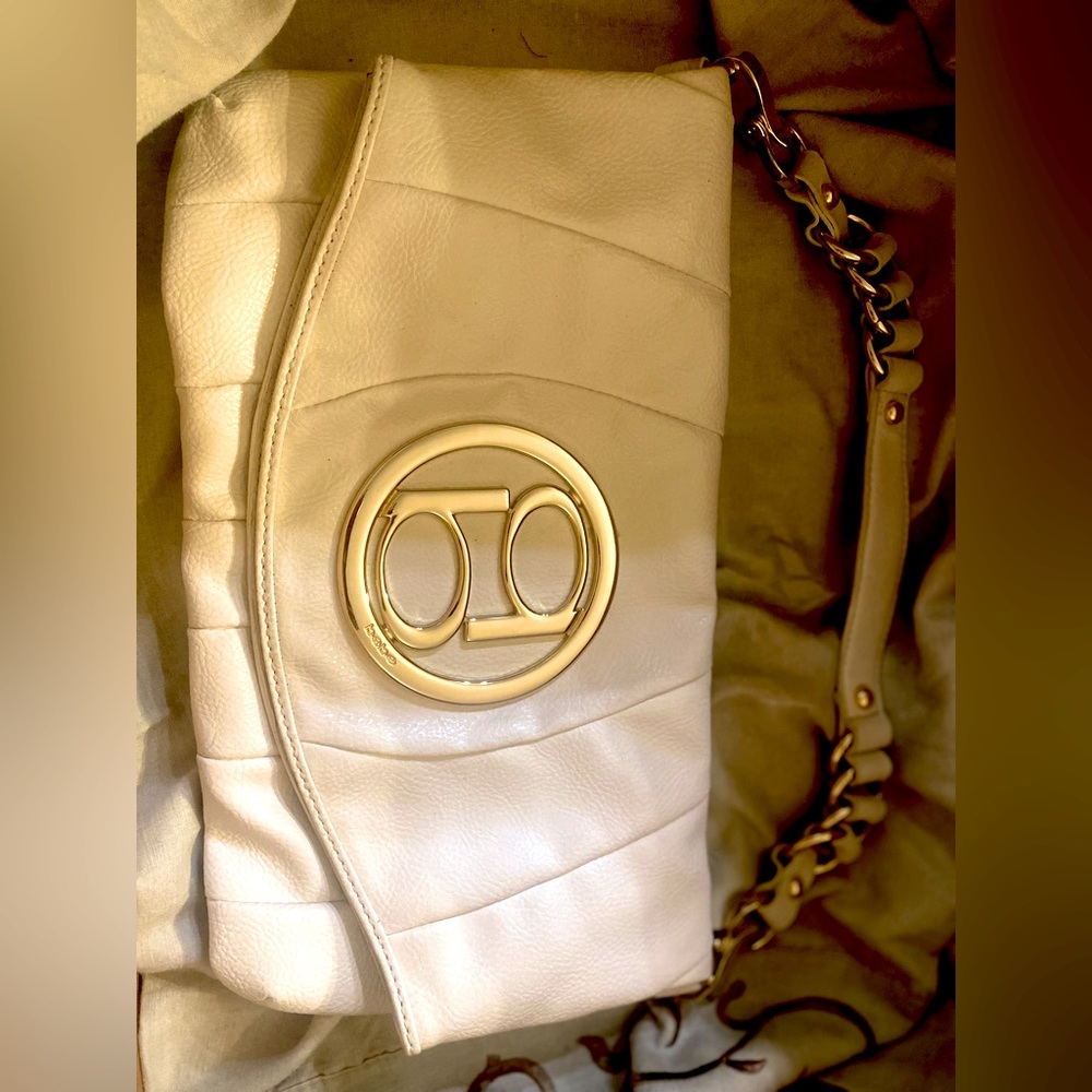Bebe brand ivory colored purse in great shape. Hardly used.